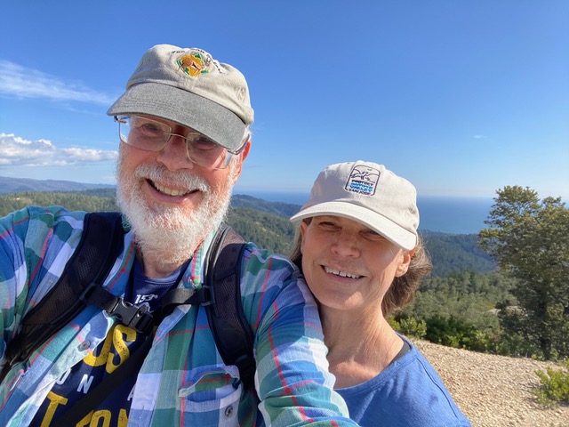 two hikers smiling
