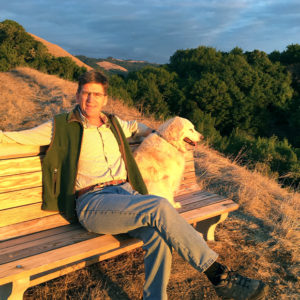 Will Wyman with dog on hillside