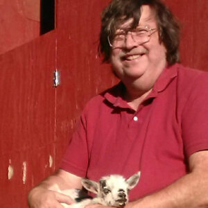 Peter Ruddock with Fonzie the baby goat